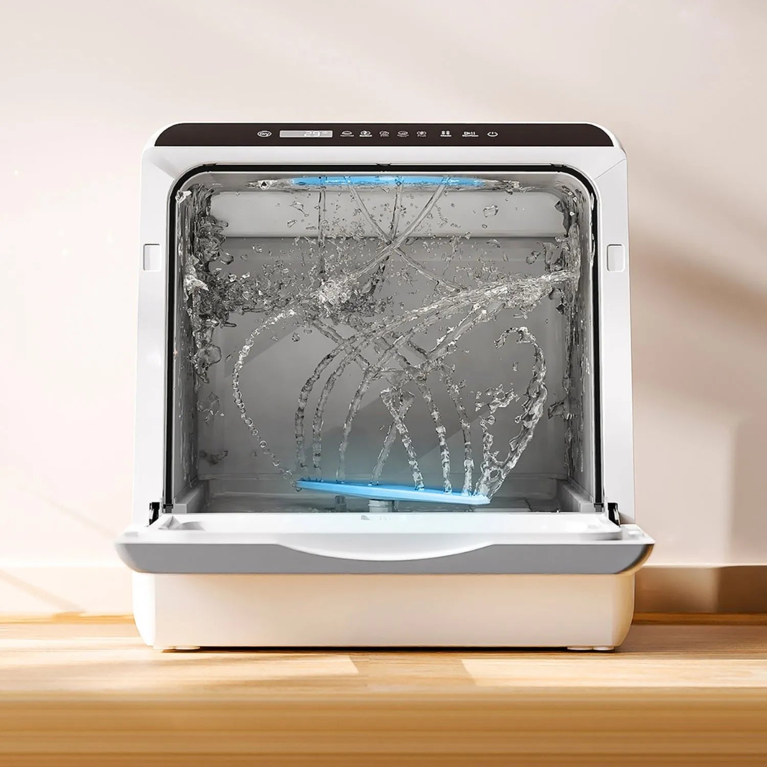 HAVA Bänkdiskmaskin från Go-clean.se under pågående diskprogram med kraftfulla vattenstrålar och blå LED-belysning som visar rengöringsprocessen.